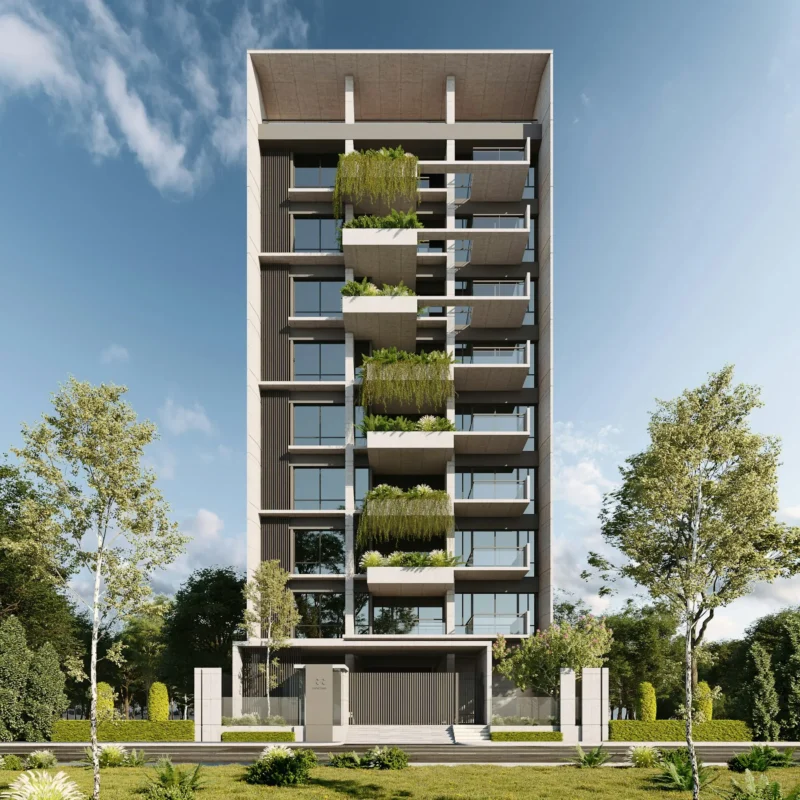 Edificio de viviendas con balcones y vegetación